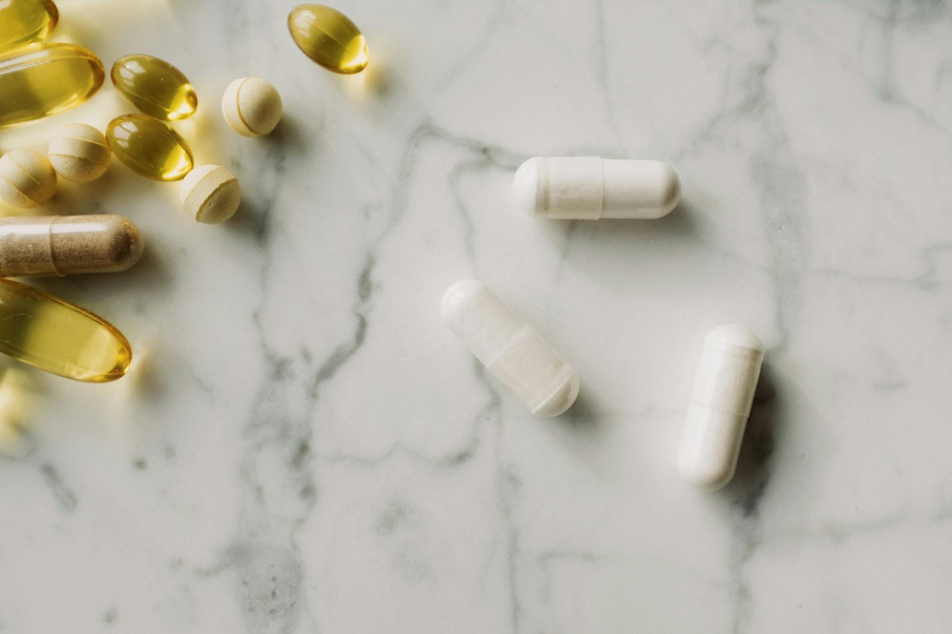 Joint supplement capsules and tablets side by side